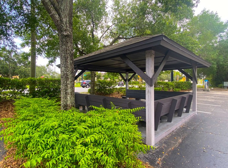 Outdoor shaded Gazebo seating next to car care center